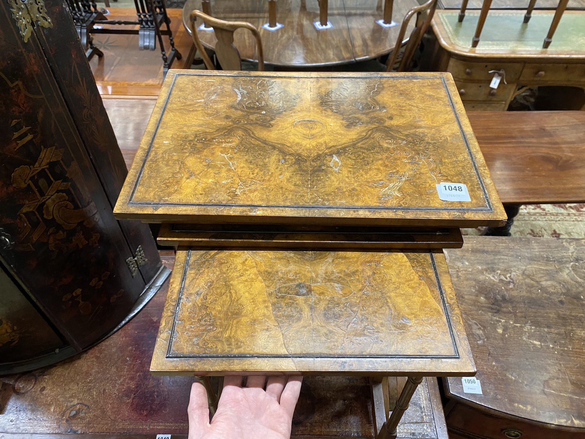 A quartetto of rectangular figured walnut tea tables, width 51cm, depth 35cm, height 64cm